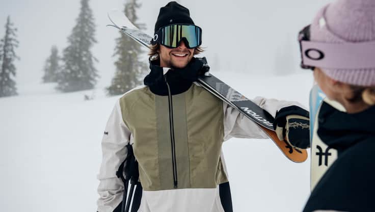 Model with a pair of beginner freeskis