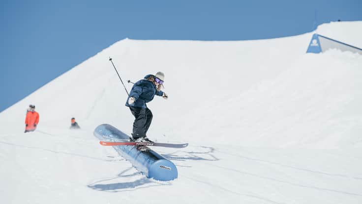 Female skiers go to the slope