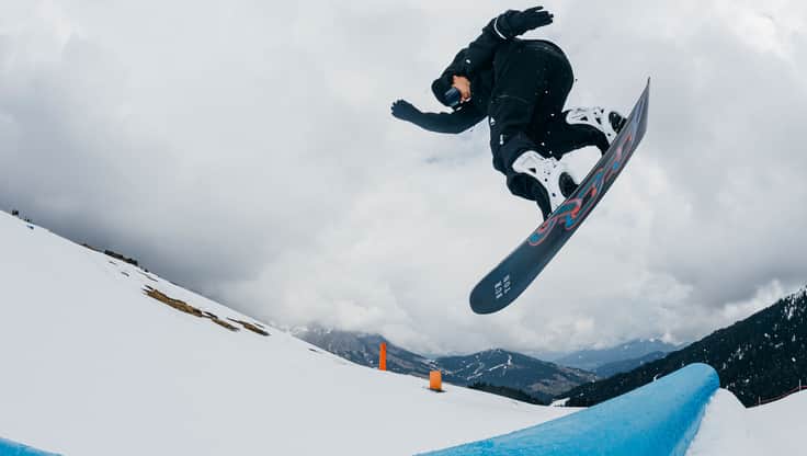 Snowboarder does tricks on the slope