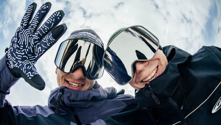 Snowboarder presents her gloves