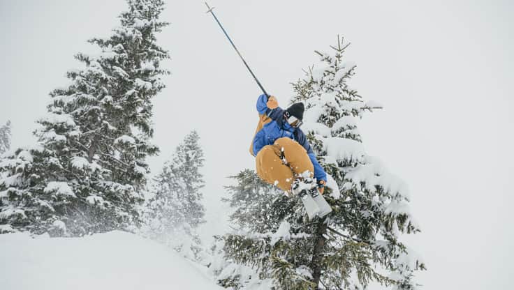 Model with a pair of freeride freeskis