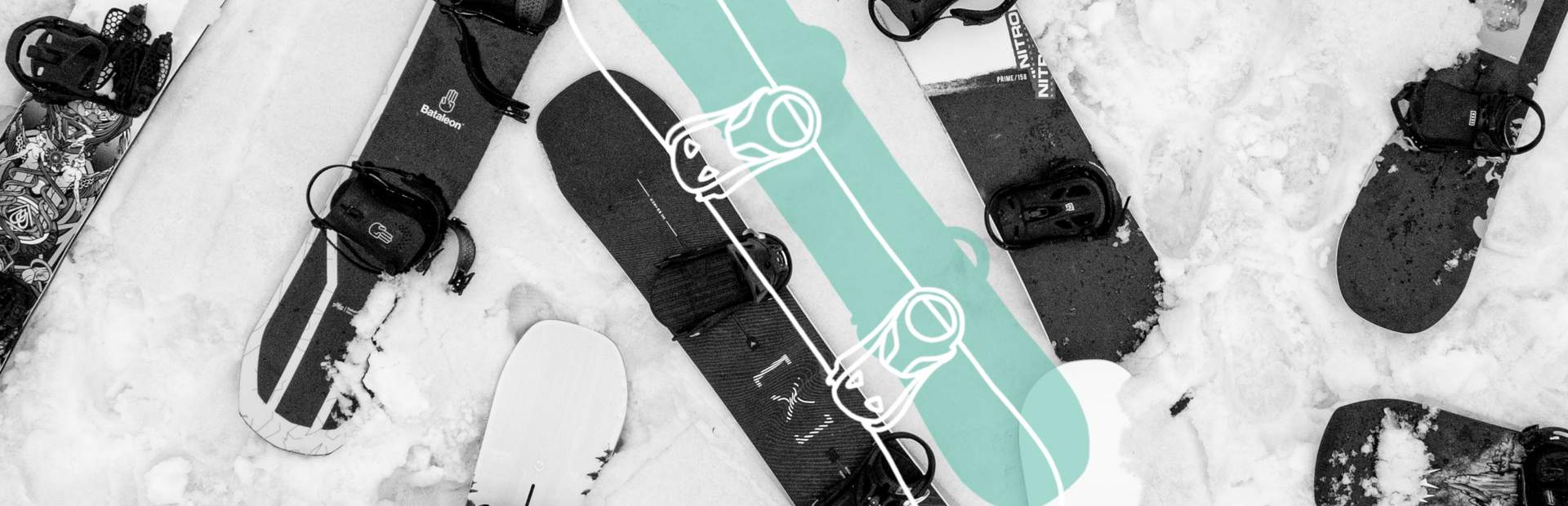Snowboarder holding his snowboarding